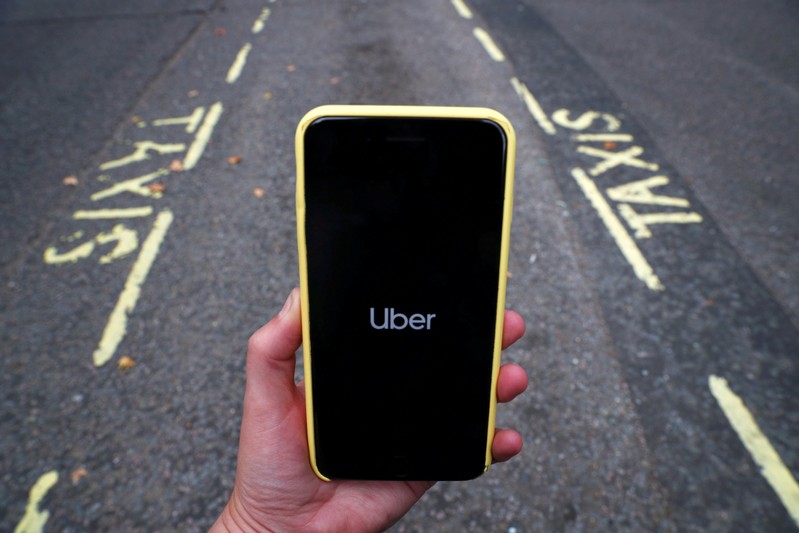 FILE PHOTO: The Uber application is seen on a mobile phone in London