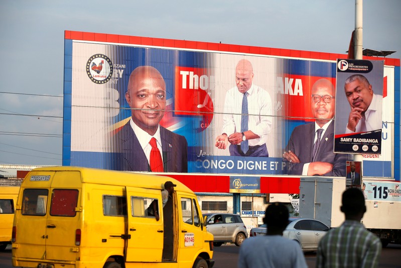 A signs rotates between pictures of presidential candidates Emmanuel Ramazani Shadary, former Congolese Interior Minister and Martin Fayulu, Congolese joint opposition in Kinshasa