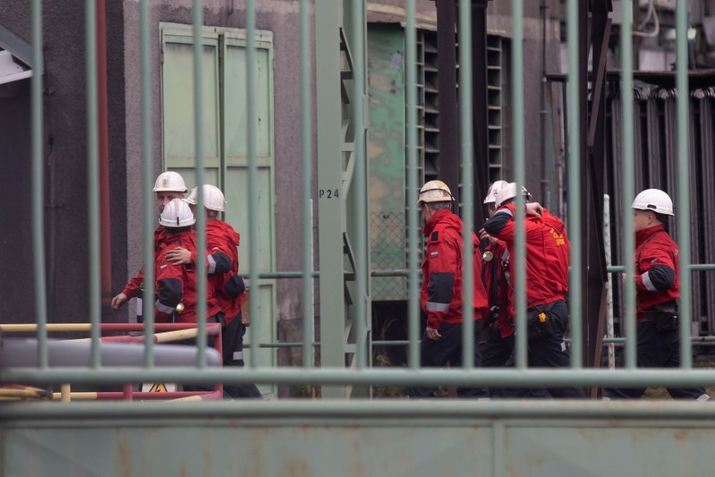 Polish rescue personnel enter a compound of the CSM hard coal mine after a methane explosion near the town of Karvina