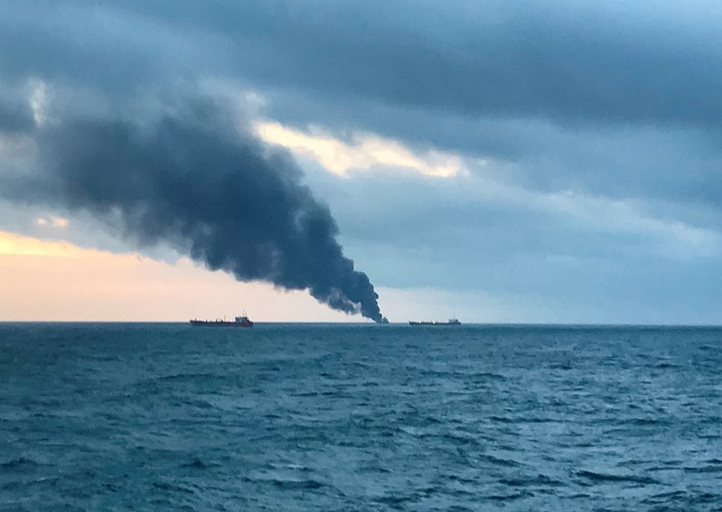 Smoke rises from a fire at a ship in the Kerch Strait near Crimea