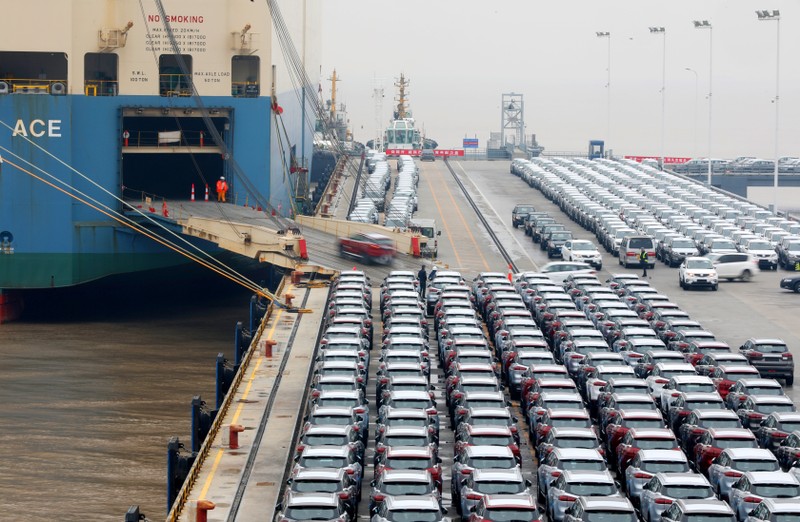 Geely cars for export enter a cargo vessel at Ningbo Zhoushan port