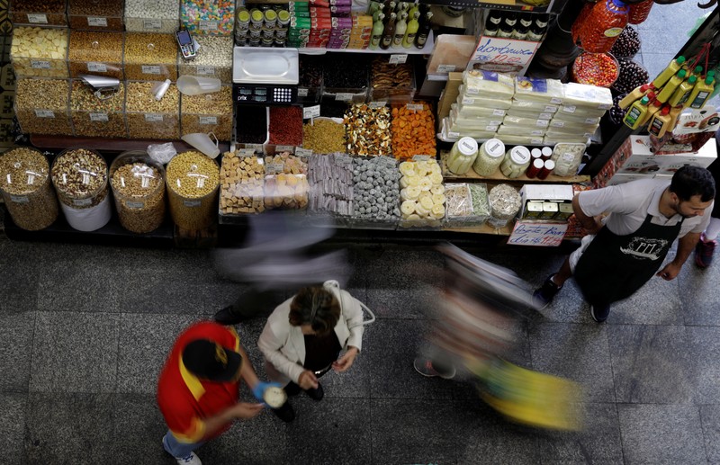 People shop at the Municipal Market of Sao Paulo in downtown Sao Paulo, Brazil