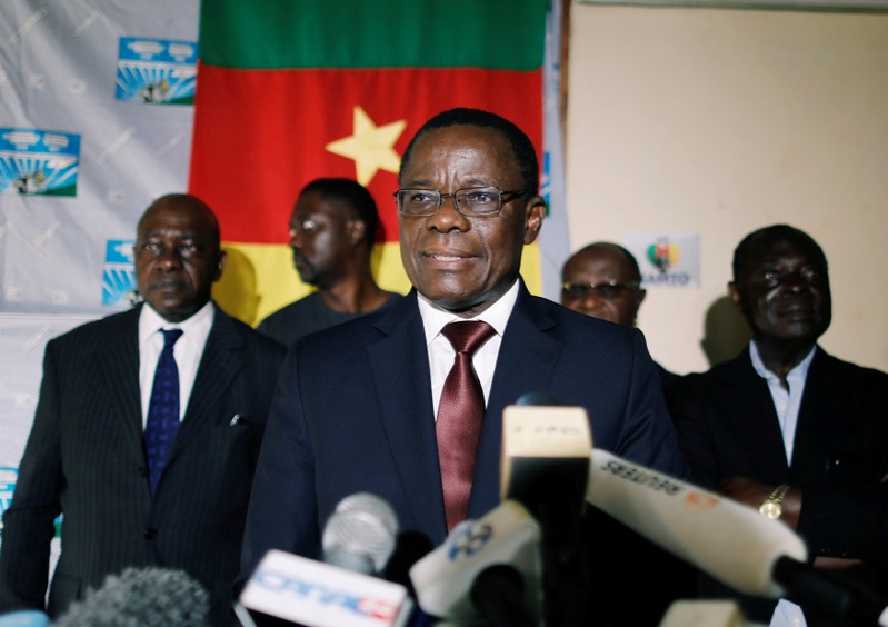 FILE PHOTO: Maurice Kamto, a presidential candidate of Renaissance Movement (MRC), reacts as he holds a news conference at his headquarter in Yaounde