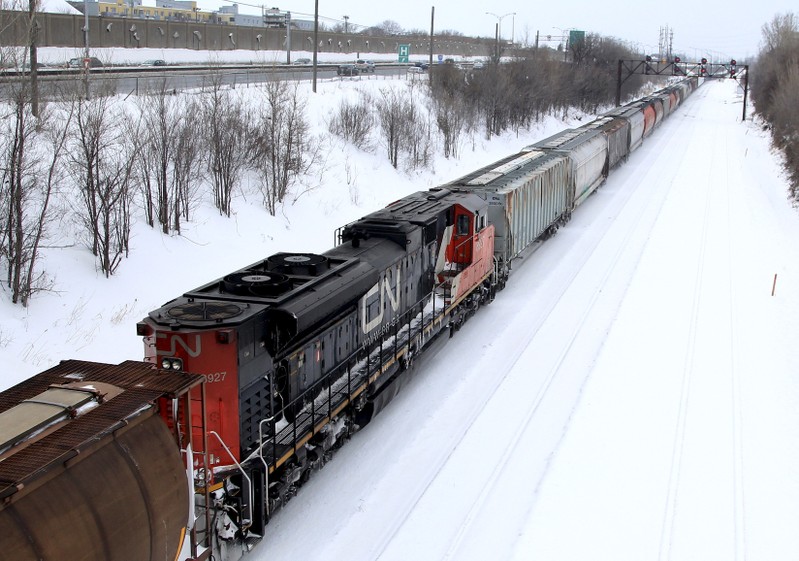 A Canadian National Railway train travels eastward on a track in Montreal