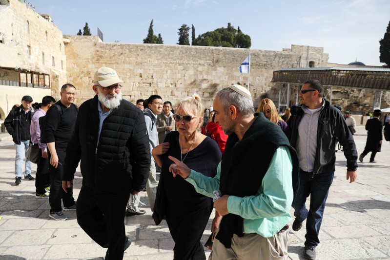 American comedian, Roseanne Barr, walks away after visiting the Western Wall, Judaism's holiest prayer site, in Jerusalem's Old City