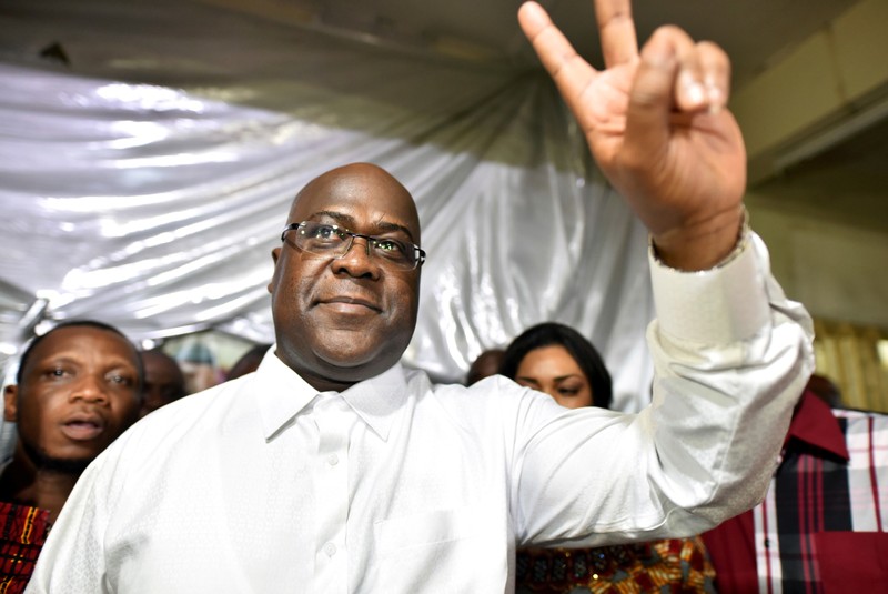 FILE PHOTO: Felix Tshisekedi, leader of the Congolese main opposition party, the Union for Democracy and Social Progress who was announced as the winner of the presidential elections gestures to his supporters at party headquarters in Kinshasa