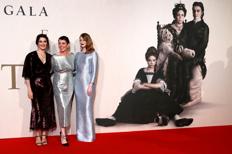 FILE PHOTO: Actors Rachel Weisz, Olivia Colman and Emma Stone pose at the UK Premiere of The Favourite during the London Film Festival