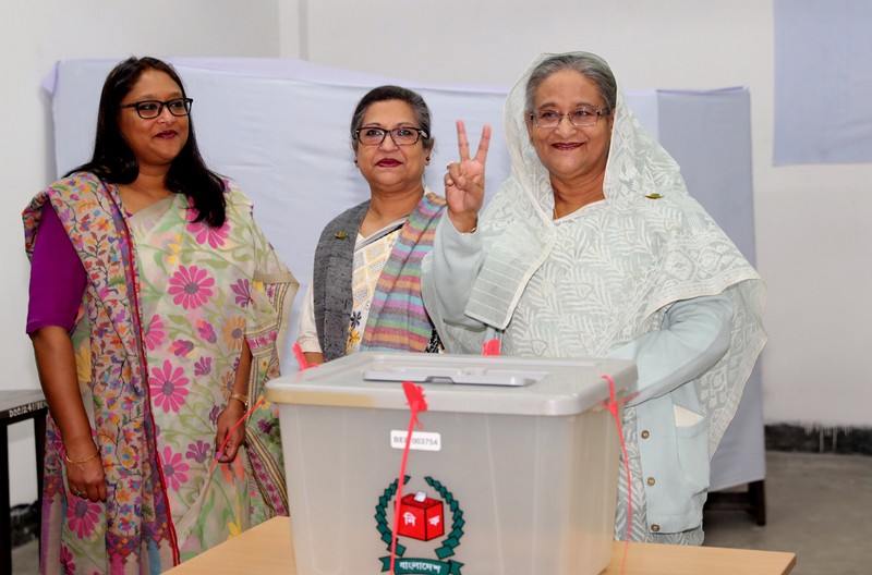 FILE PHOTO: Prime Minister Sheikh Hasina gestures after casting her vote during the general election in Dhaka