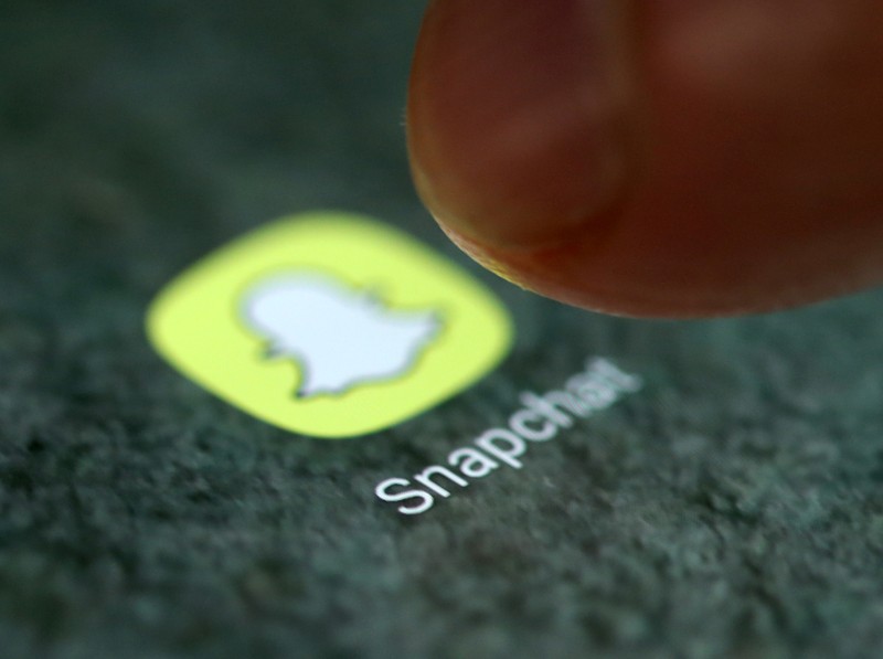 FILE PHOTO - The Snapchat app logo is seen on a smartphone in this illustration