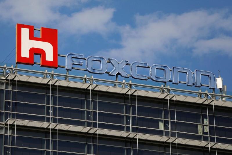 FILE PHOTO - The logo of Foxconn, the trading name of Hon Hai Precision Industry, is seen on top of the company's building in Taipei
