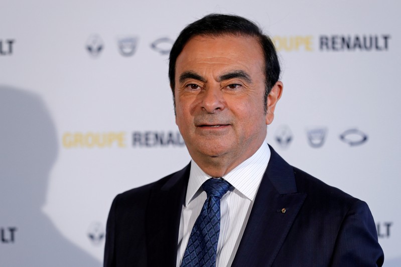 FILE PHOTO: Carlos Ghosn, Chairman and CEO of the Renault-Nissan Alliance, poses after the Renault's 2015 annual results presentation at their headquarters in Boulogne-Billancourt