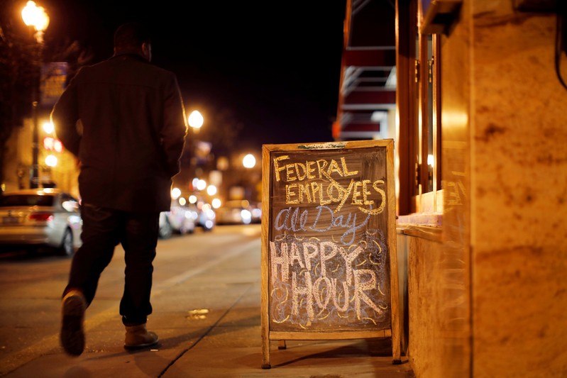 FILE PHOTO: A sign is displayed at a local bar during the partial U.S. government shutdown in Washington