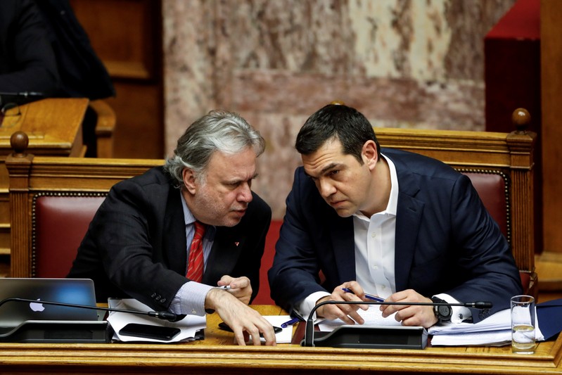 Greek PM Tsipras and Alternate Minister of Foreign Affairs Katrougalos discuss during a parliamentary session before a vote on an accord between Greece and Macedonia changing the former Yugoslav republic's name in Athens