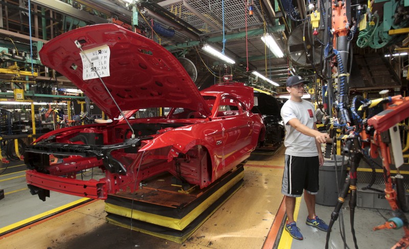 FILE PHOTO: The frame of a 2015 Ford Mustang vehicle moves down the production line at the Ford Motor Flat Rock Assembly Plant in Flat Rock, Michigan,