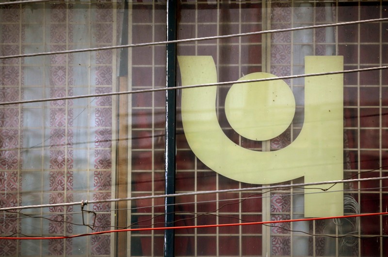 FILE PHOTO: The logo of Punjab National Bank is seen on a branch office window in New Delhi