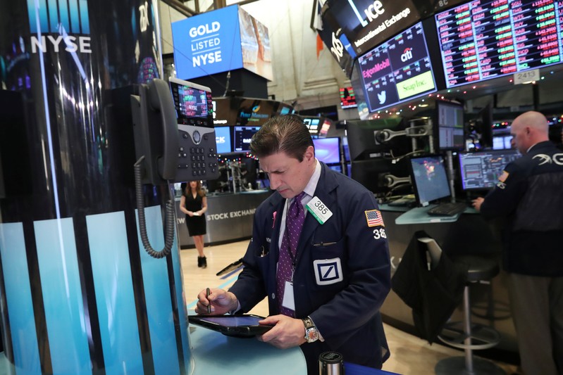 A trader works on the floor at the New York Stock Exchange (NYSE) in New York City, New York