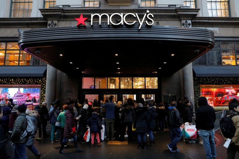 People gather at Macy's Herald Square store ahead of early opening for the Black Friday sales in Manhattan