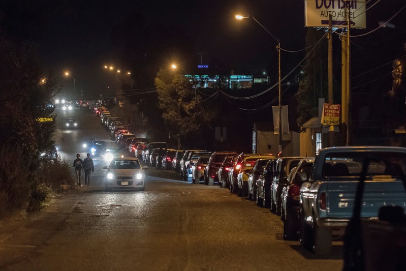 FILE PHOTO: Cars line up to enter a gas station to buy gasoline in Morelia