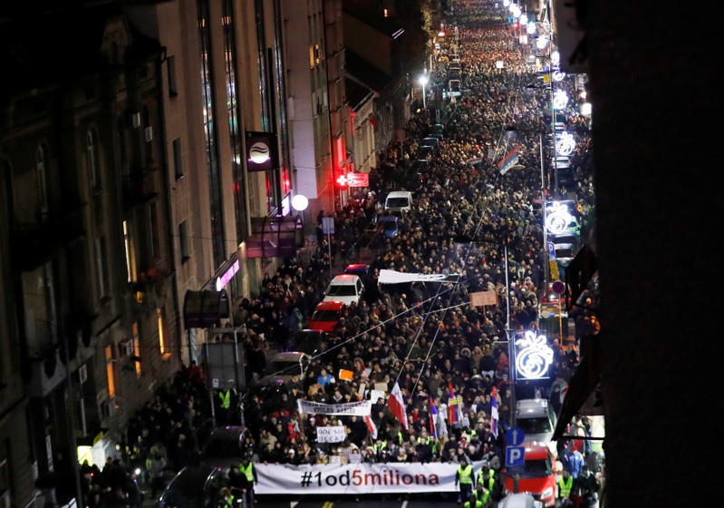 People walk during an anti-government protest in Belgrade