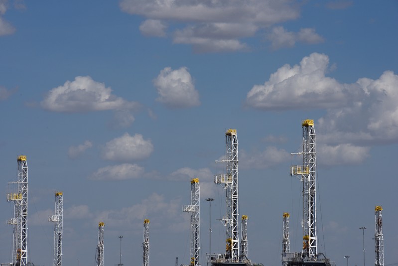 FILE PHOTO: Oil rigs in a storage facility wait to be transported to the oil field in Midland