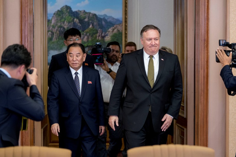 FILE PHOTO: U.S. Secretary of State Mike Pompeo and Kim Yong Chol, a North Korean senior ruling party official and former intelligence chief, return to discussions after a break at Park Hwa Guest House in Pyongyang