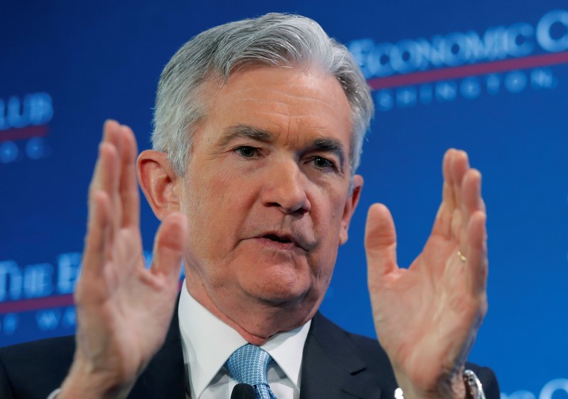 FILE PHOTO: U.S. Federal Reserve Board Chairman Powell participates in a discussion in Washington