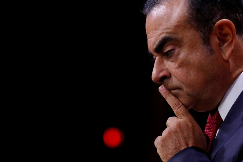 FILE PHOTO: Ghosn, Chairman and CEO of the Renault-Nissan Alliance, reacts during news conference in Paris