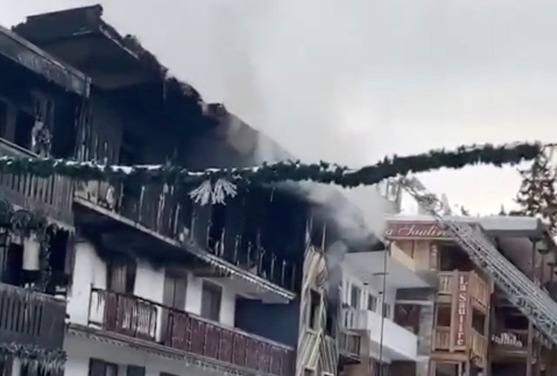 Smoke rises from a building after a fire in Courchevel ski resort