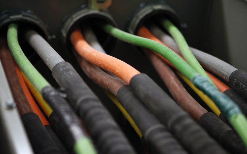 FILE PHOTO - Fiber optic cables carrying internet providers are seen running into a server room at Intergate.Manhattan, in New York