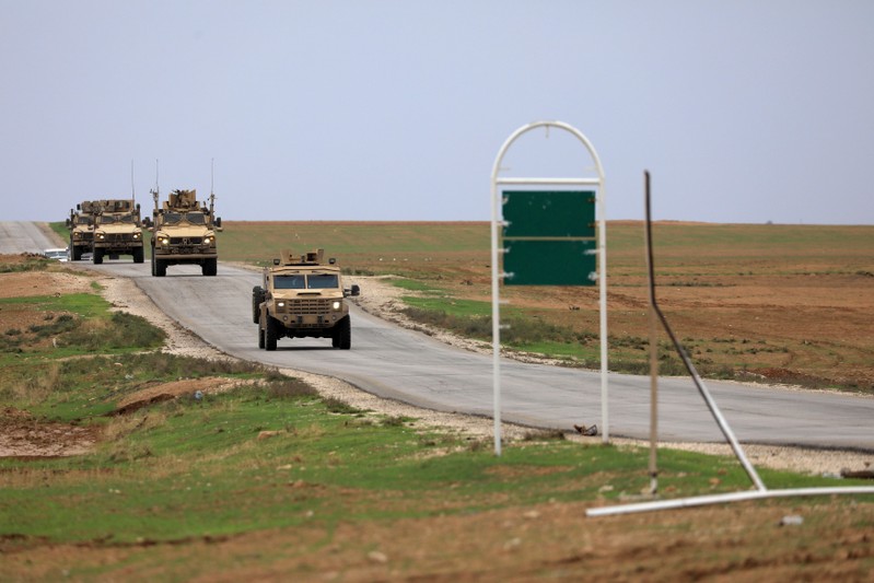 FILE PHOTO: U.S. troops patrol near Turkish border in Hasakah