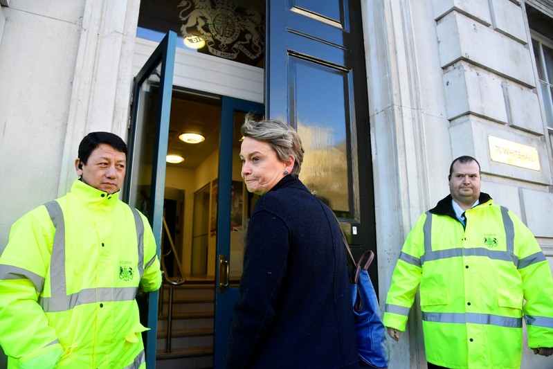 British Labour Party politician Yvette Cooper walks along Whitehall into the Cabinet office, in London