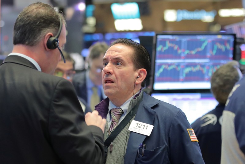 Traders work on the floor of the NYSE in New York