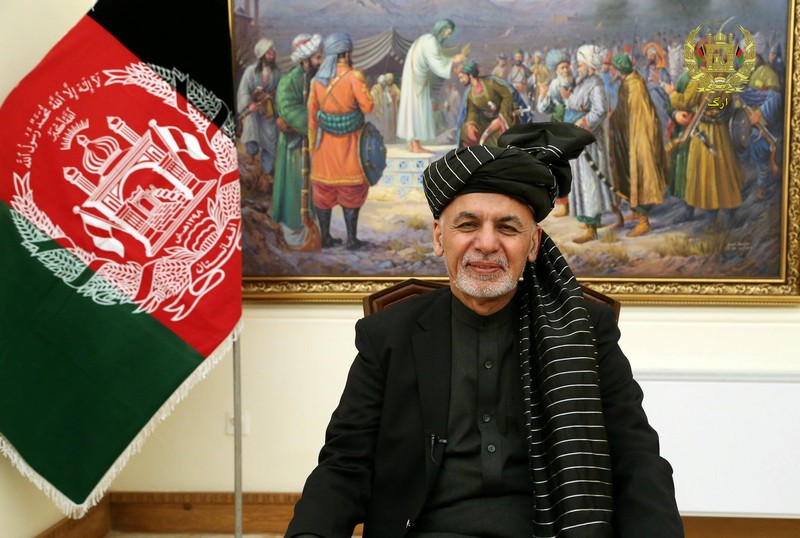 Afghanistan's President Ashraf Ghani speaks during a live TV broadcast at the presidential palace in Kabul