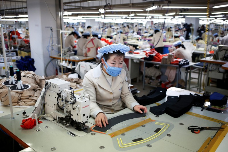 FILE PHOTO : A North Korean employee works in a factory of a South Korean company at the Joint Industrial Park in Kaesong industrial zone