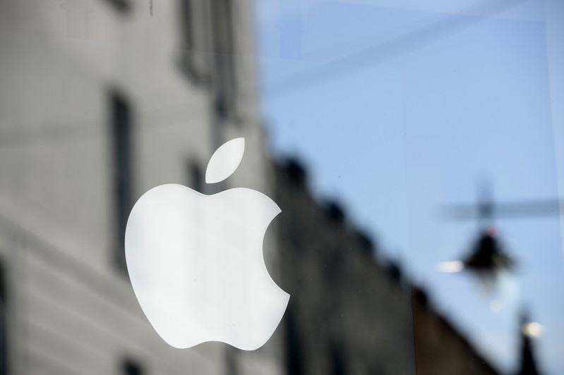 An Apple logo is seen in the window of an authorised apple reseller store in Galway