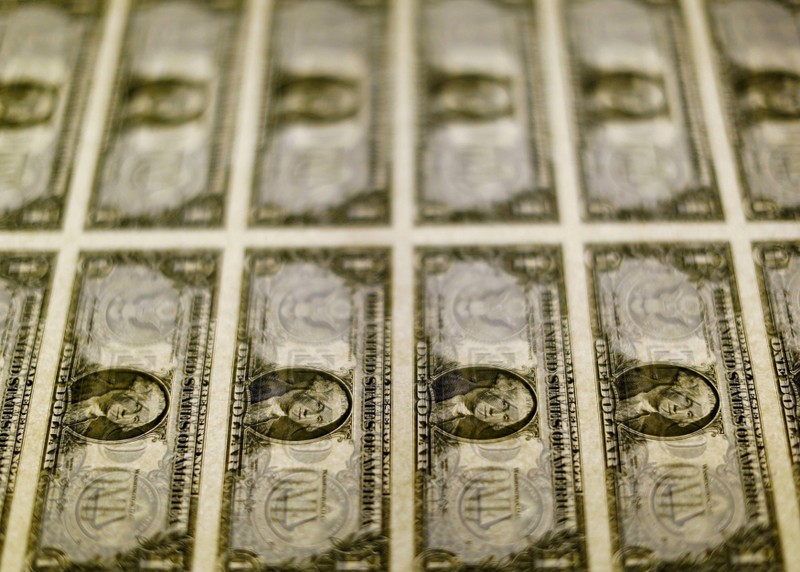 FILE PHOTO: FILE PHOTO: United States one dollar bills seen on a light table at the Bureau of Engraving and Printing in Washington