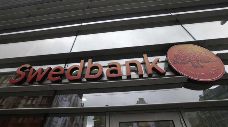 Swedbank logo is pictured on its branch in Riga