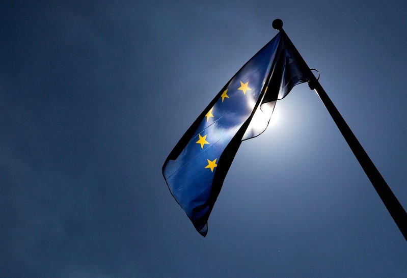 FILE PHOTO: A European Union flag flutters outside the EU Commission headquarters in Brussels