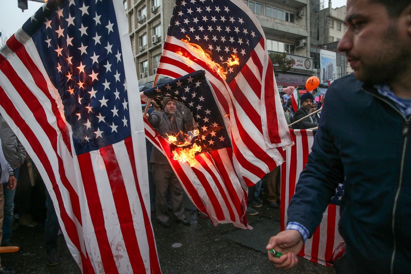 Iranians burn U.S. flags during a ceremony to mark the 40th anniversary of the Islamic Revolution in Tehran