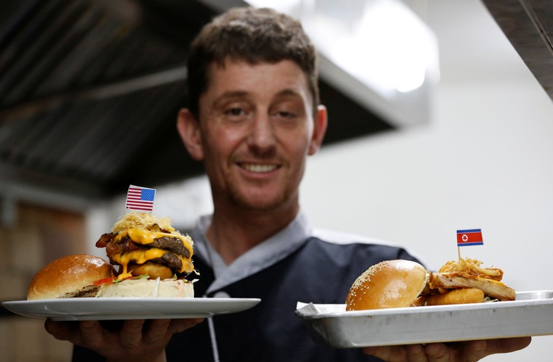 Chef Colin Lilly shows his new burgers Durty Donald and Kim Jong Yum at his restaurant promoting for upcoming USA-DPRK summit in Hanoi
