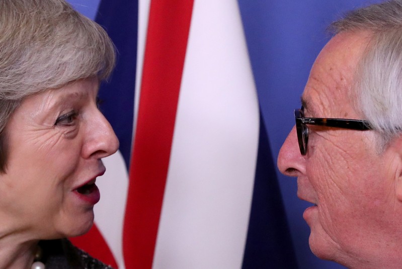 FILE PHOTO: Juncker and May discuss Brexit in Brussels