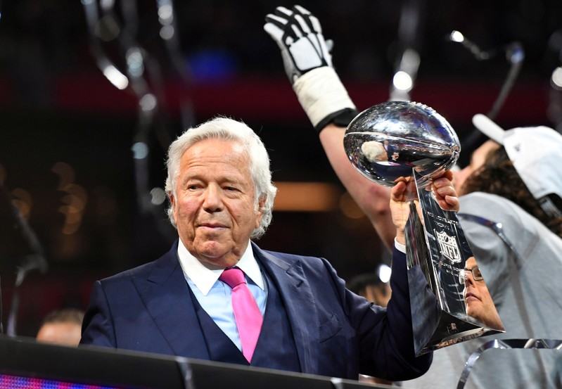 FILE PHOTO: New England Patriots owner Robert Kraft raises the Vince Lombardi Trophy after winning Super Bowl LIII against the Los Angeles Rams at Mercedes-Benz Stadium in Atlanta