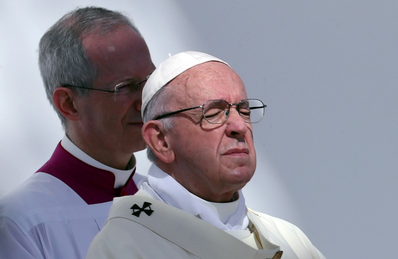 Pope Francis holds a mass at Zayed Sports City Stadium in Abu Dhabi