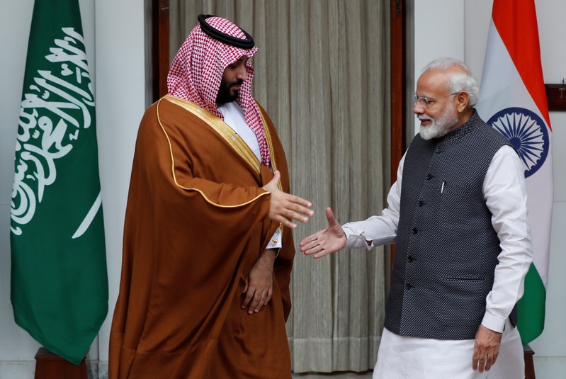 Saudi Arabia's Crown Prince Mohammed bin Salman shakes hands with India's Prime Minister Narendra Modi ahead of their meeting at Hyderabad House in New Delhi