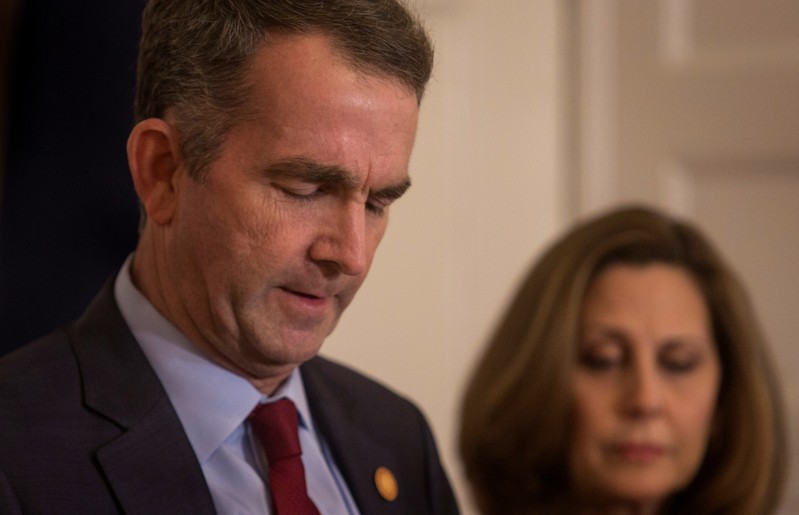 Virginia Governor Ralph Northam, accompanied by his wife Pamela Northam announces he will not resign during a news conference in Richmond