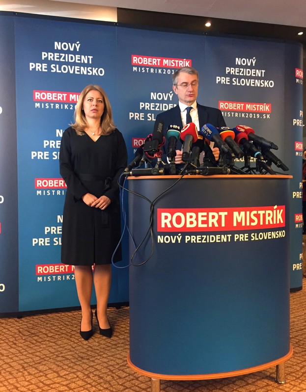 Robert Mistrik, who withdrew from the presidential race, and presidential candidate Zuzana Caputova attend a news conference in Bratislava