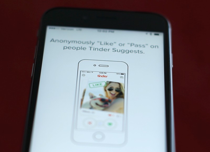 FILE PHOTO - Photo illustration of dating app Tinder shown on an Apple iPhone