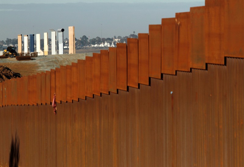 FILE PHOTO: FILE PHOTO: The prototypes for U.S. President Donald Trump's border wall are seen behind the border fence between Mexico and the United States, in Tijuana