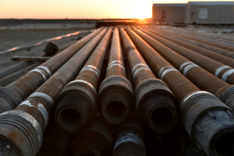 FILE PHOTO: Steel drill pipe is seen at sunrise on an oil lease owned by Parsley Energy in the Permian Basin near Midland