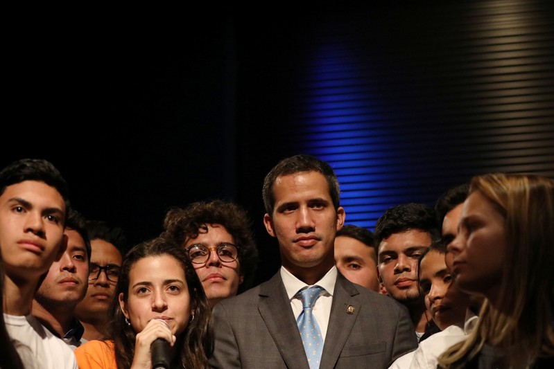 Venezuelan opposition leader Juan Guaido, who many nations have recognized as the country's rightful interim ruler, talks with students in Caracas